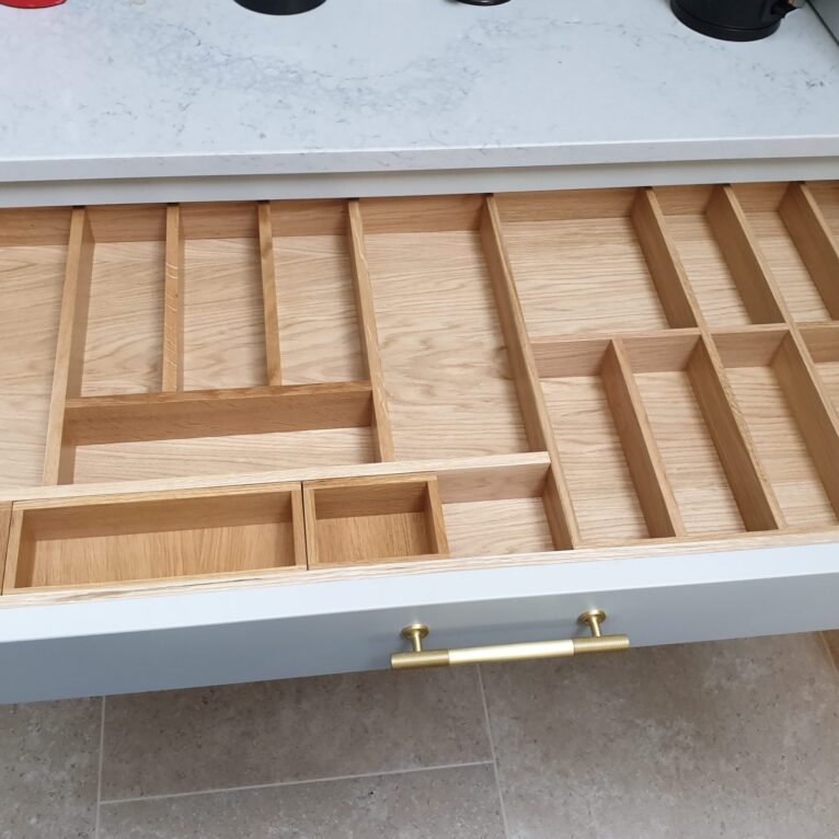 A kitchen with a cutlery drawer insert.