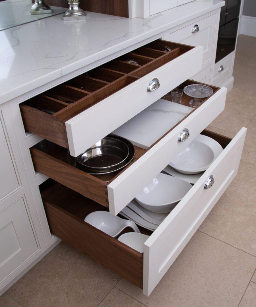A kitchen with a Probox drawer full of plates and bowls.
